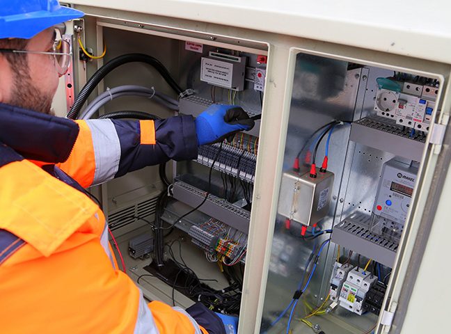 about-us-img-1 Electrician Checking Wires